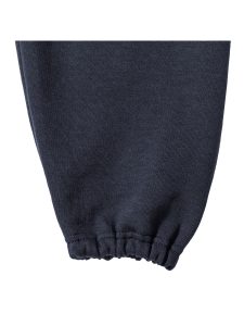 Close-up view of an elasticated leg end on on navy jogging bottoms
