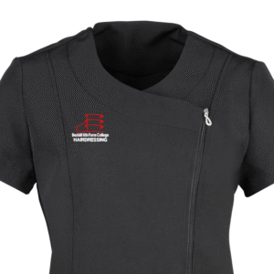 Close up view of the top of the Bexhill College hairdressing tunic. A black tunic with the college's logo