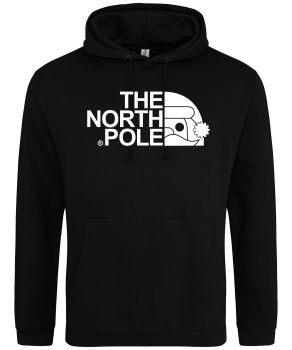 Frontal view of the "North Pole" Christmas hoodie: a black hoodie in front of white background. Printed to the front is white text that reads "THE NORTH POLE". Alligned next to the text is a half Santa face wearing a Christmas hat - all in white.