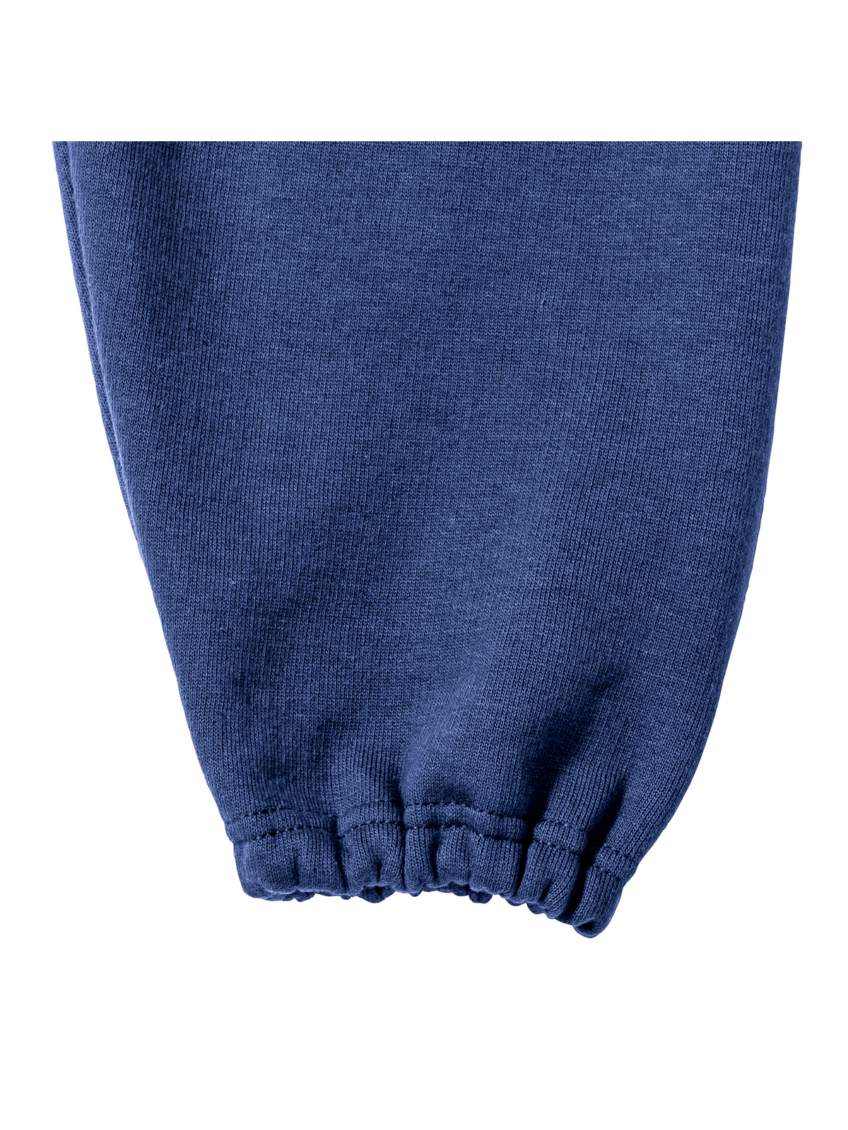 Close-up view of an elasticated leg end on on royal-blue jogging bottoms