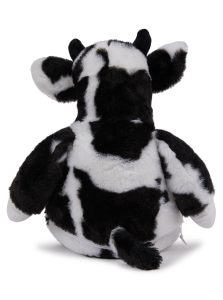 Rear view of a cow teddy in front of a white background.