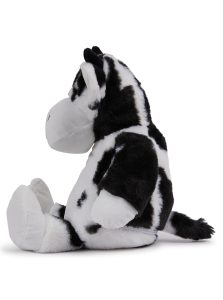 Side view of a cow teddy in front of a white background.