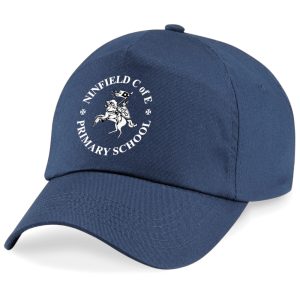 Frontal view of the Ninfield Primary School navy cap with the school's emblem printed on the front.