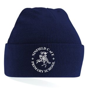 Frontal view of the Ninfield Primary School navy winter beanie with the school's emblem embroidered on the front.