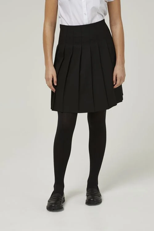 Frontal view of someone wearing a black premium stitch-down pleated skirt with a tucked-in white blouse and black tights.