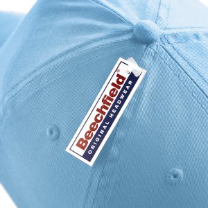 Close up view of a Beechfield tag on a sky blue cap.