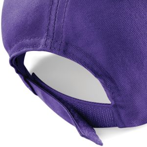 Close up view of the adjuster on the back of a purple cap.