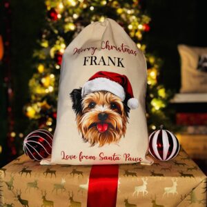 A photo of a natural coloured Christmas sack with a picture of a Yorkshire terrier dog on the front with the personalised text "Merry Christmas Frank Love From Santa Paws" split above and below.