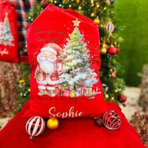 A personalised red Santa Christmas sack with a custom name printed on it.