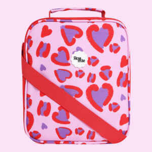In front of a baby pink background: a baby pink lunch bag with imagery of varying sized child-like drawings of hearts with a disjointed red outline and purple center.