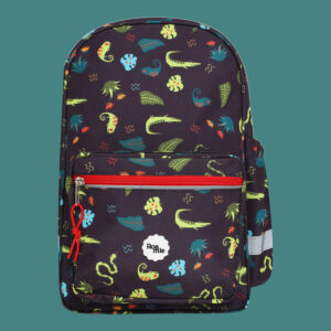 In front of a teal background: a kids' black backpack with imagery of dark teal and green lizards amongst various leaves and plants of the jungle.