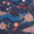 Sharks and various tropical fish against a navy background with waves in different shades of blue.